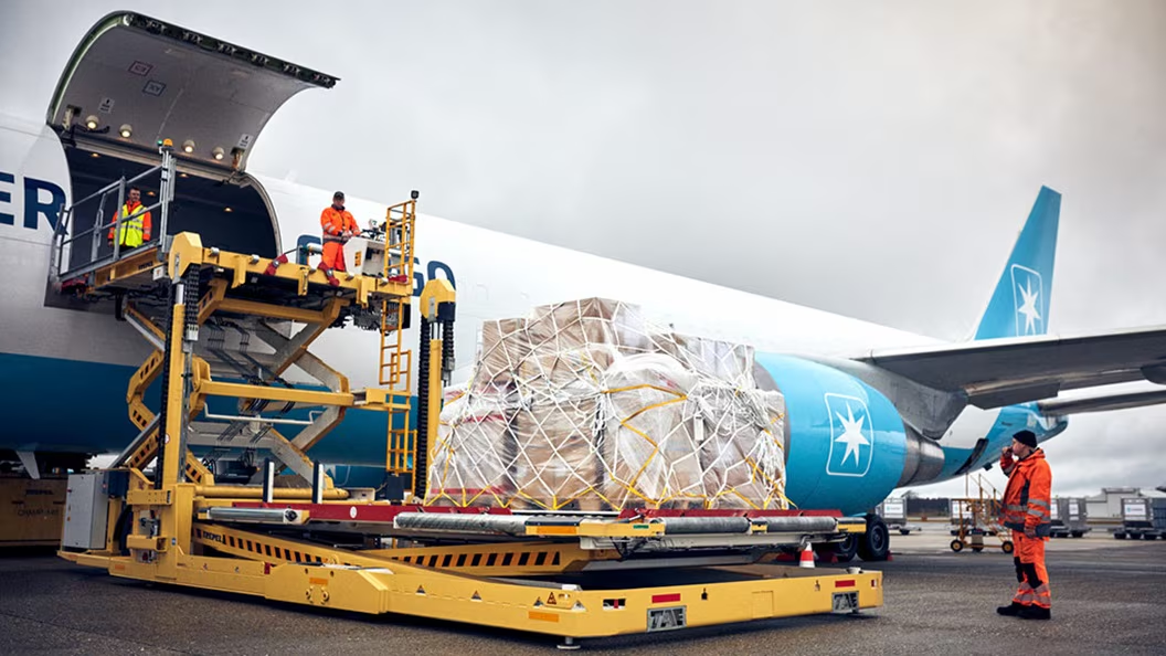 Cargo being loaded onto airplane